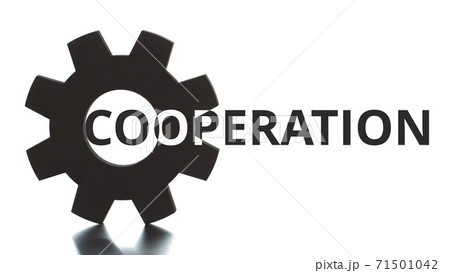 COOPERATION black and white text pops up from the cogwheel 71501042