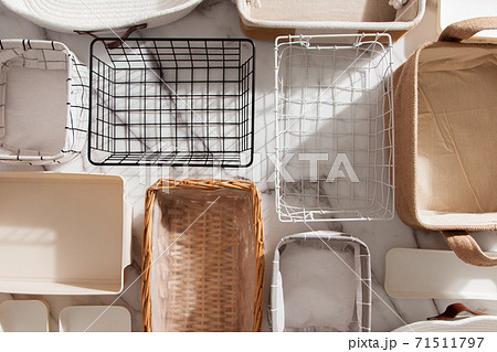 Flat lay of Marie Kondo's storage boxes, containers and baskets with different sizes and shapes 71511797
