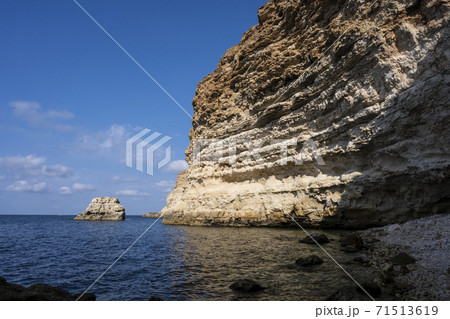 Beach on the shore of a steep Bank. Sevastopol, Republic Of Crimea, Russia. A clear, Sunny morning of 24 September 2020 Beach on the shore of a steep Bank. Sevastopol, Republic Of Crimea, Russia. A clear, Sunny morning of 24 September 2020 71513619