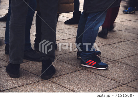 Mens' legs with footwear standing on pavement Mens' legs with footwear standing on pavement 71515687