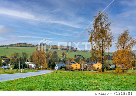 autumn rural panorama with a view of the village, trees and fields 71518201