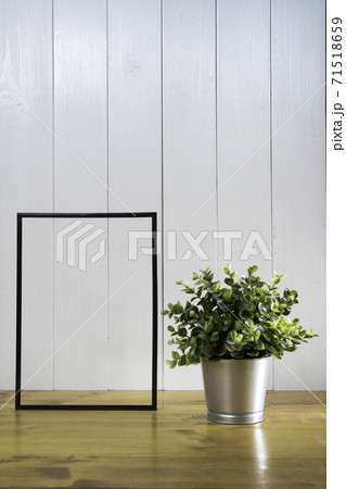 ne blank black frame and a flowerpot ne blank black frame and a flowerpot 71518659