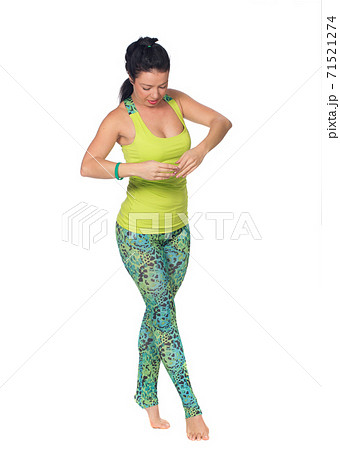 Cheerful young exercising woman, isolated over white background 71521274