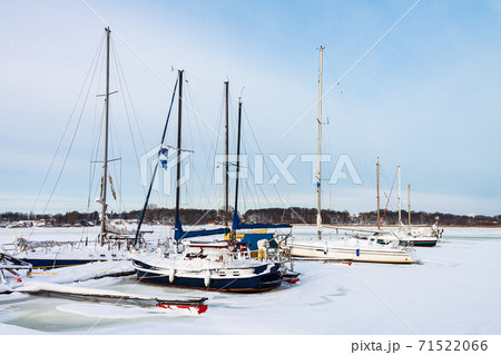 Sailboats in the city port in winter time in Rostock, Germany Sailboats in the city port in winter time in Rostock, Germany 71522066