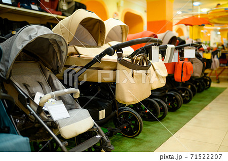 Row of baby strollers in children's store, nobody 71522207
