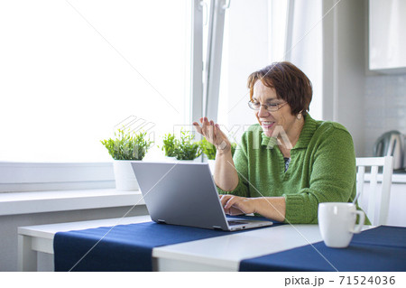 Portrait of a senior woman having online video-call. Portrait of a senior woman having online video-call. 71524036
