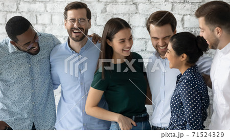 Overjoyed millennial multiethnic friends gathered together on informal meeting 71524329