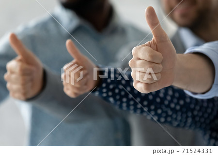 Multiethnic people hands raised in thumbs up gesture recommending quality 71524331