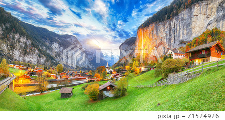 Dramatic autumn view of Lauterbrunnen valley with gorgeous Staubbach waterfall and Swiss Alps  71524926