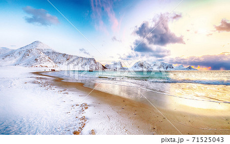 Fantastic winter view of  Haukland beach during sunset with lots of snow  and snowy  mountain peaks near Leknes 71525043