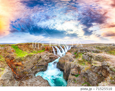 Dramaic view of  Kolufossar waterfall at sunset. 71525510