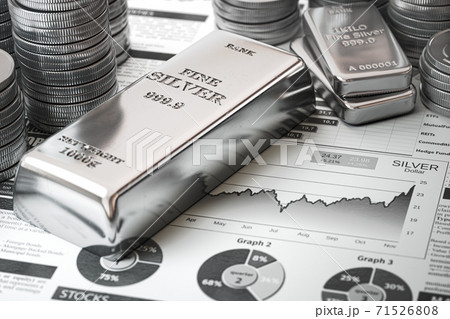 Silver bar, ingots and coins on financial  report. Growth of silver on stock market concept. 71526808