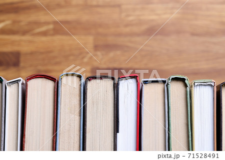 There are books in row on table closeup There are books in row on table closeup 71528491
