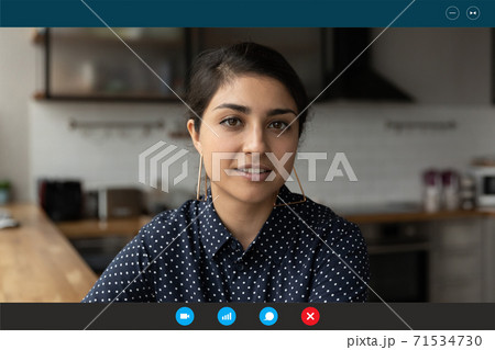 Beautiful young happy indian ethnicity woman holding video call. 71534730