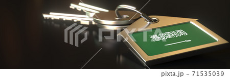 Flag of Saudi arabia on the keychain with two keys. House rental or residence concepts, 3d rendering Flag of Saudi arabia on the keychain with two keys. House rental or residence concepts, 3d rendering 71535039