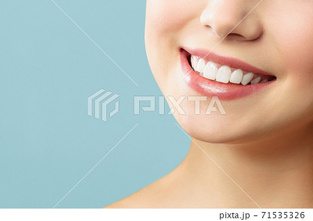 Perfect healthy teeth smile of a young woman. Teeth whitening. Stomatology concept. 71535326
