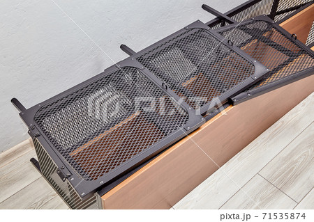 Disassembled modern wood shelf with black metal doors. 71535874