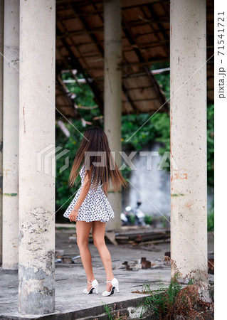 Young model posing in the ruined building 71541721