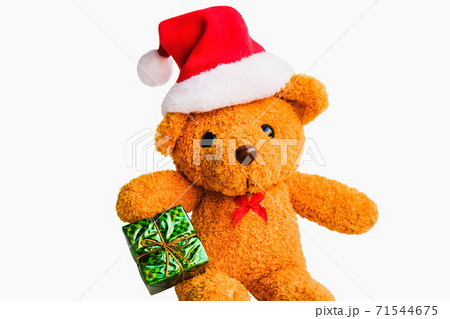 Cute brown bear wearing Santa outfits and hats. Happy smile with many colorful gift boxes isolated on white background,Christmas day and New Year's gifts Cute brown bear wearing Santa outfits and hats. Happy smile with many colorful gift boxes isolated on white background,Christmas day and New Year's gifts 71544675