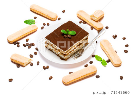 Traditional Italian Tiramisu square dessert portion on ceramic plate, savoiardi cookies and coffee beans isolated on white Traditional Italian Tiramisu square dessert portion on ceramic plate, savoiardi cookies and coffee beans isolated on white 71545660