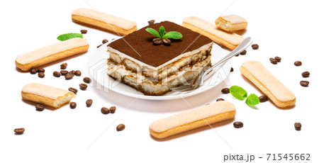 Traditional Italian Tiramisu square dessert portion on ceramic plate, savoiardi cookies and coffee beans isolated on white Traditional Italian Tiramisu square dessert portion on ceramic plate, savoiardi cookies and coffee beans isolated on white 71545662