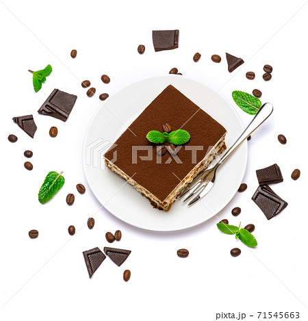 Traditional Italian Tiramisu square dessert portion on ceramic plate, pieces of chocolate bar and coffee beans isolated on white 71545663