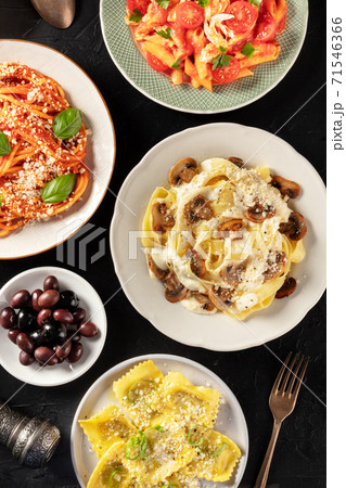 Italian pasta, various dishes, shot from above on a dark background Italian pasta, various dishes, shot from above on a dark background 71546366