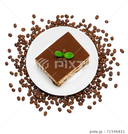 Traditional Italian Tiramisu square dessert portion on ceramic plate and coffee beans isolated on white 71546831