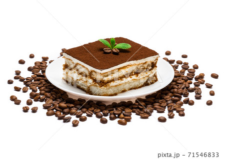 Traditional Italian Tiramisu square dessert portion on ceramic plate and coffee beans isolated on white 71546833