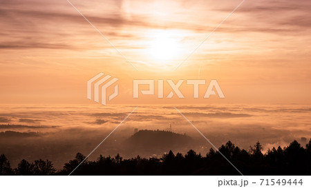 Panorama of Graz city in Styria on autumn morning during sunraise above fog Panorama of Graz city in Styria on autumn morning during sunraise above fog 71549444
