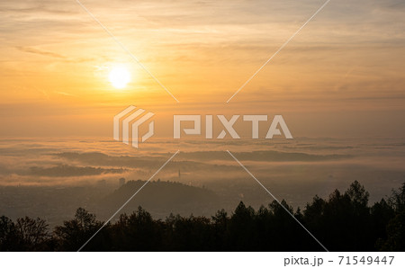 Panorama of Graz city in Styria on autumn morning during sunraise above fog 71549447
