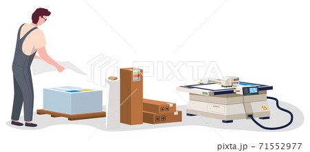 Man working in typography at print to printer. Print house worker stacks printed sheets of paper 71552977