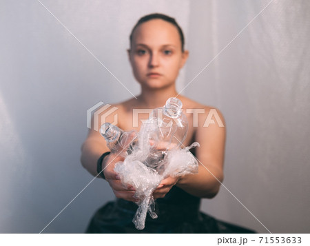plastic pollution defocused woman used bottle 71553633