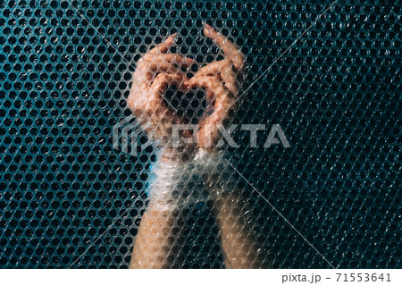 human rights forced labour tied hands bubble wrap 71553641