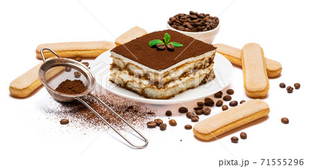 Traditional Italian Tiramisu dessert square portion on ceramic plate and savoiardi cookies isolated on white Traditional Italian Tiramisu dessert square portion on ceramic plate and savoiardi cookies isolated on white 71555296