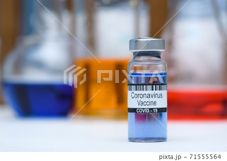 Coronavirus vaccine in bottle for injection on table against background medical laboratory, space for text. Defeating SARS-CoV-2 coronavirus epidemic. Scientists have found vaccine against coronavirus Coronavirus vaccine in bottle for injection on table against background medical laboratory, space for text. Defeating SARS-CoV-2 coronavirus epidemic. Scientists have found vaccine against coronavirus 71555564