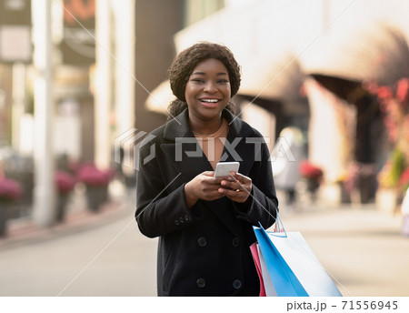 Mobile app and cash back at Black Friday and season sale concept 71556945