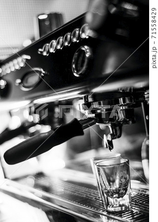 making espresso coffee close up detail with modern machine making espresso coffee close up detail with modern machine 71558429