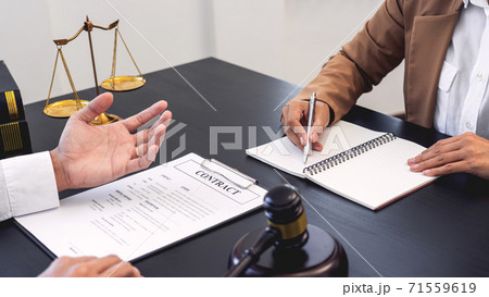 lawyer or judge meeting with client consulting help discussing contract paper agreement. lawyer or judge meeting with client consulting help discussing contract paper agreement. 71559619