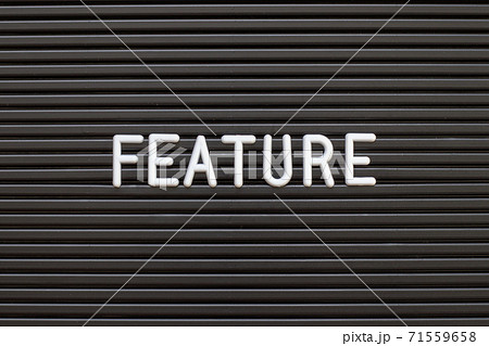 Black color felt letter board with white alphabet in word feature background Black color felt letter board with white alphabet in word feature background 71559658