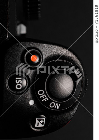 Shutter button and camera power button close up, rear view of the camera. Shutter button and camera power button close up, rear view of the camera. 71561819