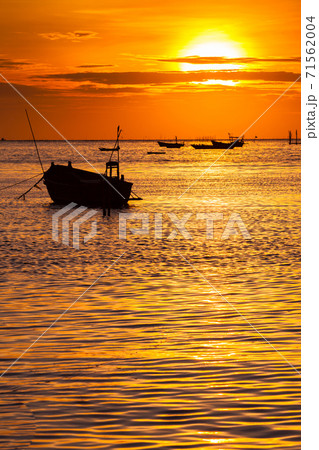 boats are floating under colorful sky at sunset time 71562004