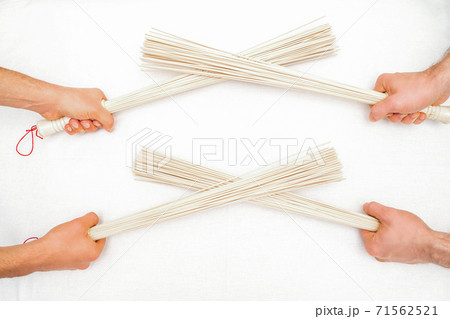 Bamboo massage brooms on white Bamboo massage brooms on white 71562521