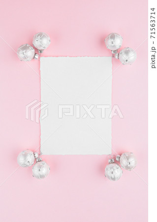 Christmas card mockup with white balls decoration on a pink pastel background 71563714