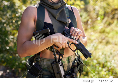 Sniper reload his rifle in forest Stock Photo by ©Nesterenko_Max 89103288