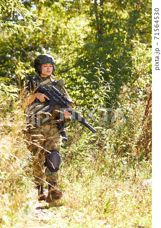 brave caucasian woman is engaged in hunting weapon gun or rifle brave caucasian woman is engaged in hunting weapon gun or rifle 71564530