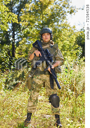 brave caucasian woman is engaged in hunting weapon gun or rifle brave caucasian woman is engaged in hunting weapon gun or rifle 71564536