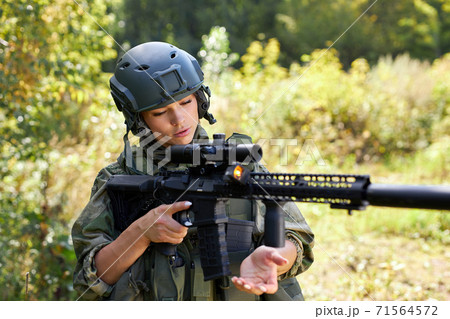 brave caucasian woman is engaged in hunting weapon gun or rifle brave caucasian woman is engaged in hunting weapon gun or rifle 71564572