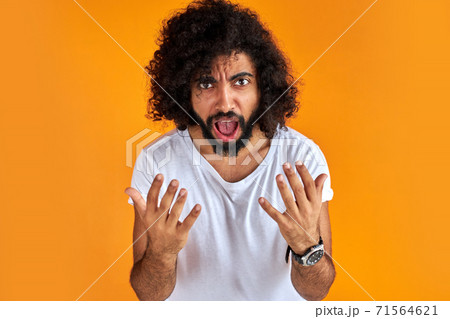furious curly bearded man shout at someone furious curly bearded man shout at someone 71564621