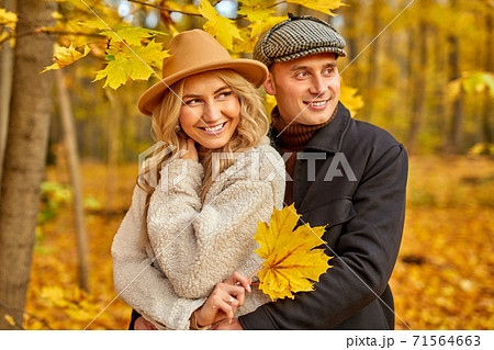 happy caucasian family couple enjoy being in autumn nature 71564663